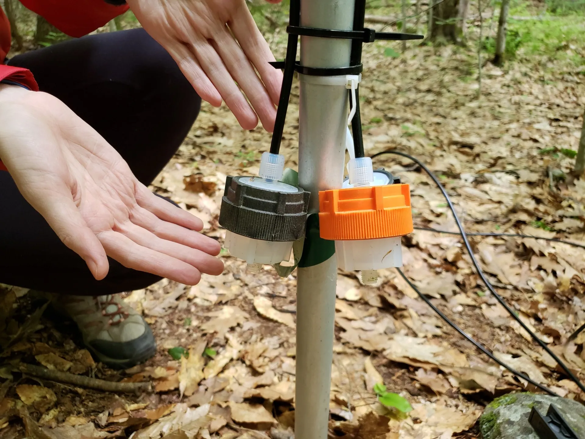 Emily modeling the lower sampling inlet at the same height as other measurements