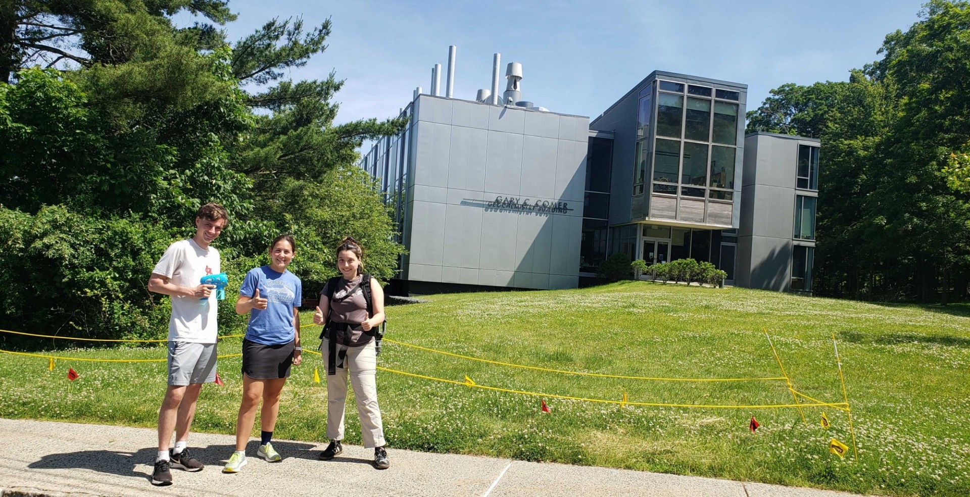 Andrew, Rebecca and Christine sampling methane in front of the soil collars in front of the Comer building on the LDEO campus